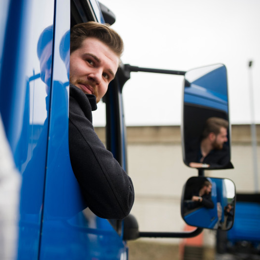 man-in-truck-looking-back
