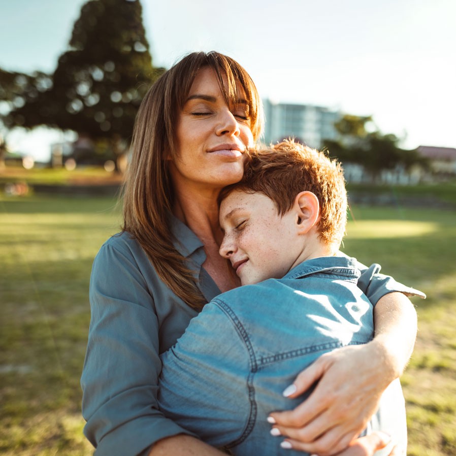 Mother hugging son