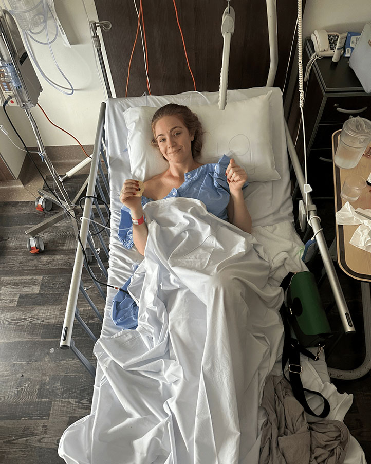 Jessica Brady recovering in a hospital bed during a serious health crisis.